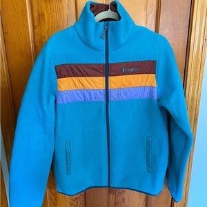 Cotopaxi Blue and Brown Puffer Jacket with Retro Stripes